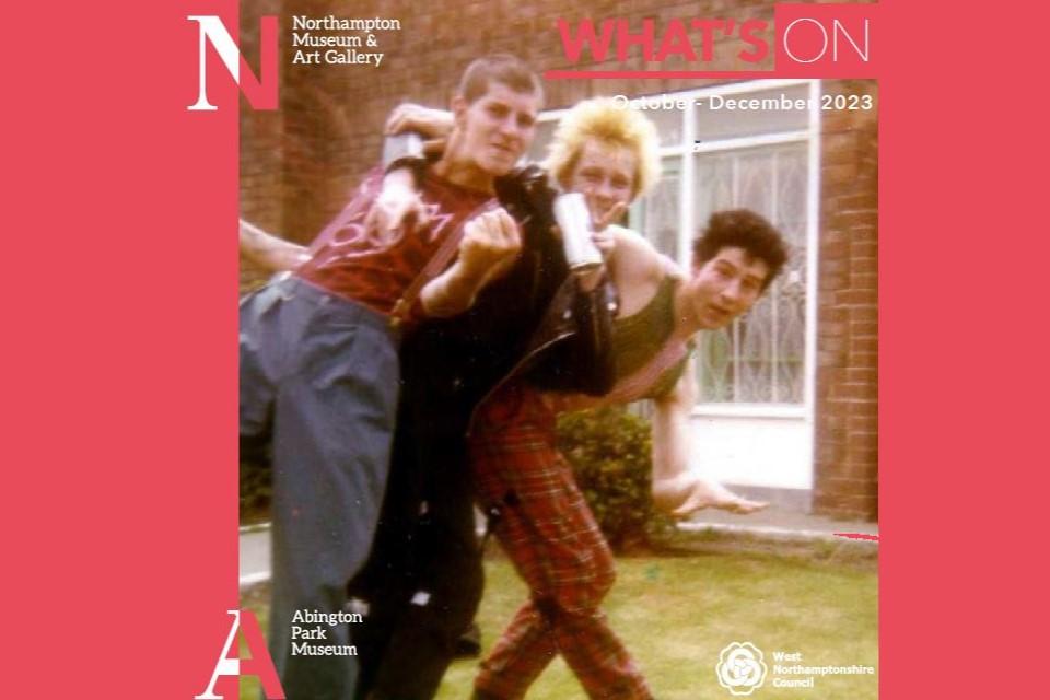 Image of the front cover of the Northampton Museum and Art Gallery What's On brochure. It depicts an image of 3 people facing the camera dressed in punk fashion. The image is framed by red strips with the Museum logo.