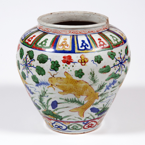 A white jar decorated with yellow carp and multi-coloured natural and geometric shapes