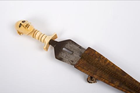 Metal dagger in leather sheath with ivory head of a women handle.