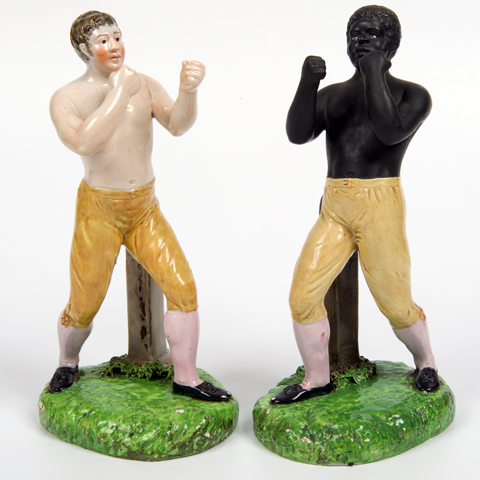 A pair of ceramic pugilists or boxers, Tom Cribb on left and Tom Molineux on right