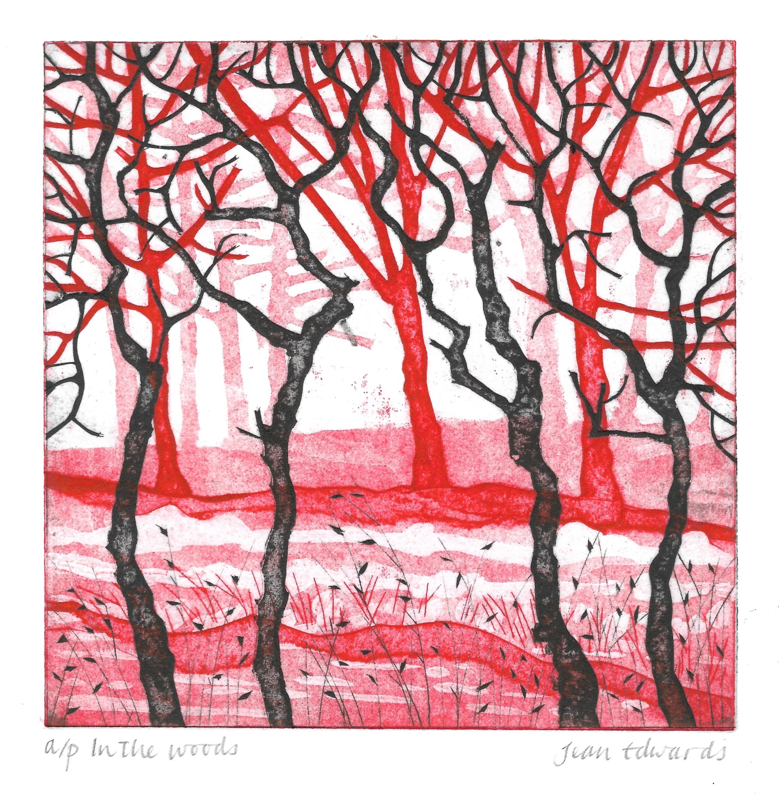 Square print of a stylised woodland scene in red, pink, black and white. Bare trees with twisting black and red trunks and branches fill the image, creating an intricate web of lines against a pale background. The ground is layered with sweeping bands of pink and red, dotted with fine grasses and small dark leaf-like marks. The artwork has a textured, hand-printed appearance with strong contrast between the dark trees and vivid red tones. Handwritten text beneath the image reads “a/p In the woods” on the left and “Jean Edwards” on the right.